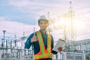 facility-inspector-tablet-computer-work-holding-factory-pole-machine-high-transmission-tower